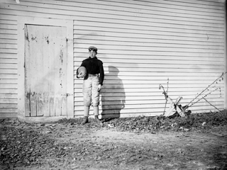 Ted Higgins standing with football