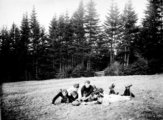 Team lying around football