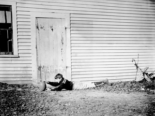 Ted Higgins lying down with football