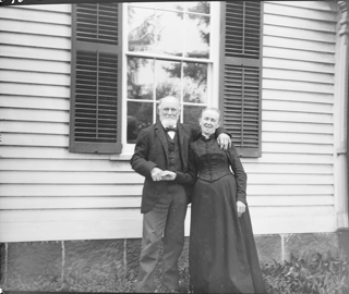 Father and Mother before west window facing camera