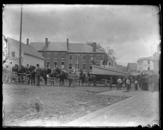 <em>The Senator</em> pulled by multiple horses en route from Ellsworth to Green Lake