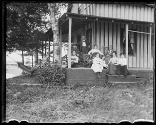 Group on porch at Pleasant Beach, 1900