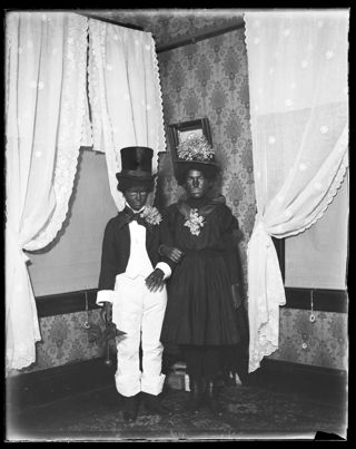 Marion Woodward and Bernice in black face and costumes for cake walk NOT FOR PUBLIC