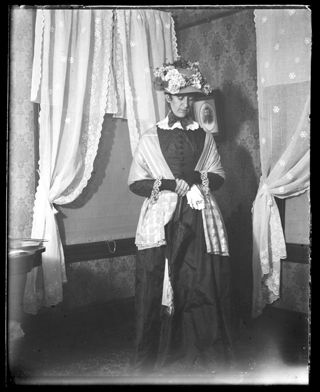 Annie Persis Woodward, wife of photographer, in old fashioned costume