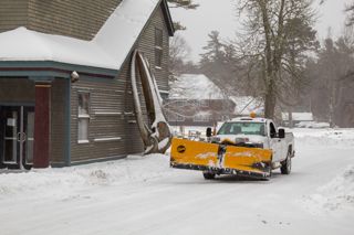Millard Dority plowing campus drive