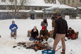 Students gather around campus fire pit