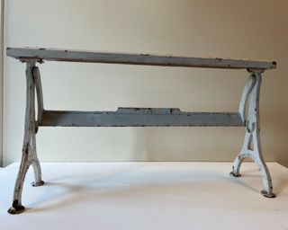 Cast iron wrapping paper stand