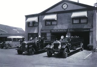 Fire trucks parked in front of the Municipal Building, Northeast Harbor, circa 1935