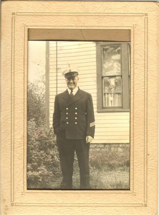 Sanford Colson in front of Jarvis house