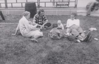 M. Gifford and some family on the front lawn of Gifford - Bragdon house