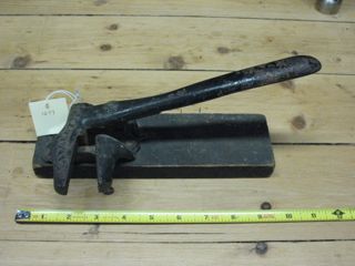 Boatbuilding tool on wood base similar to nut cracker