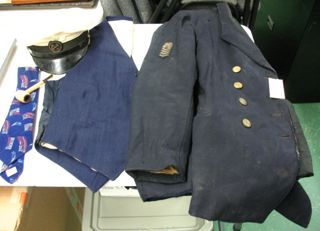 Captain's clothing belonging to Elwood Spurling, and Philmore Spurling's corncob pipe