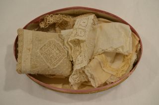 Spurling - Julia Marie Spurling's hand-laced handkerchiefs and needlepoint pillow.
