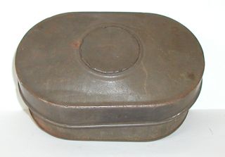 Oval tin box with lid