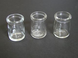 3 small glass cream bottles