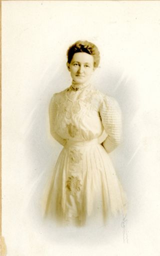 Color tinted photo of woman in white dress with grey background