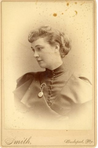 Portrait of woman in dark button.up dress