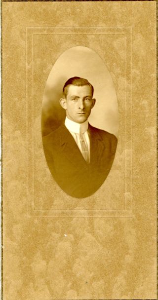 Portrait of man in dark suit with stiff white collar