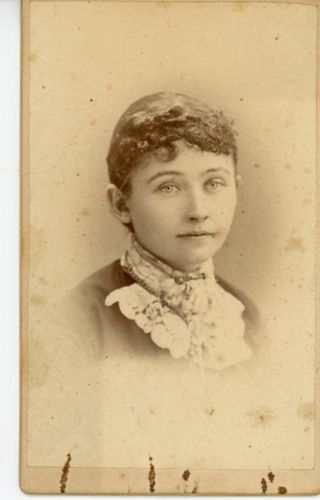 Woman in dark dress with lace collar