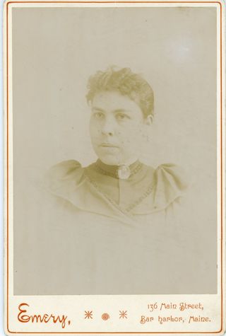 Unidentified Woman with short hair and a cameo