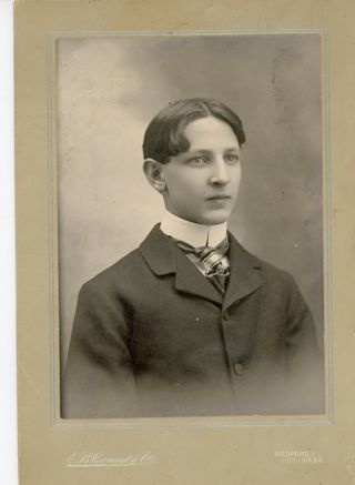Portrait of young man in dark suit