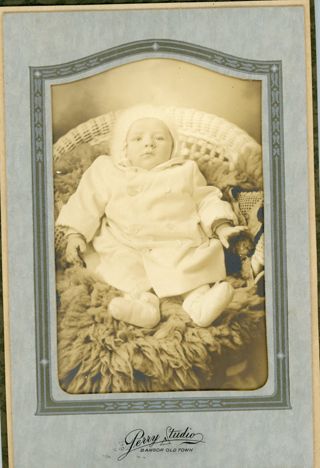 baby reclined on sheepskin