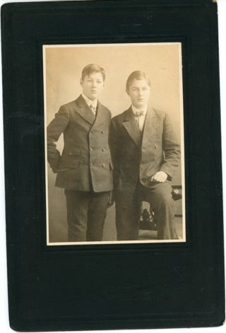 Two young boy in suits