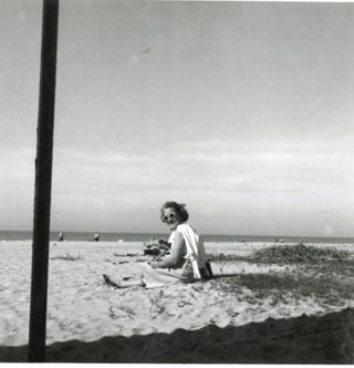 Louise Gilbert sitting on the beach