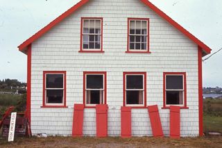 White building with red shutters