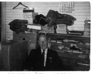 Raymond P. Somes at his store