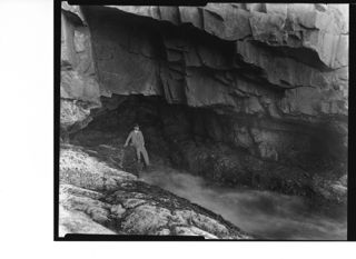 George Dorr in seashore cave, c. 1940
