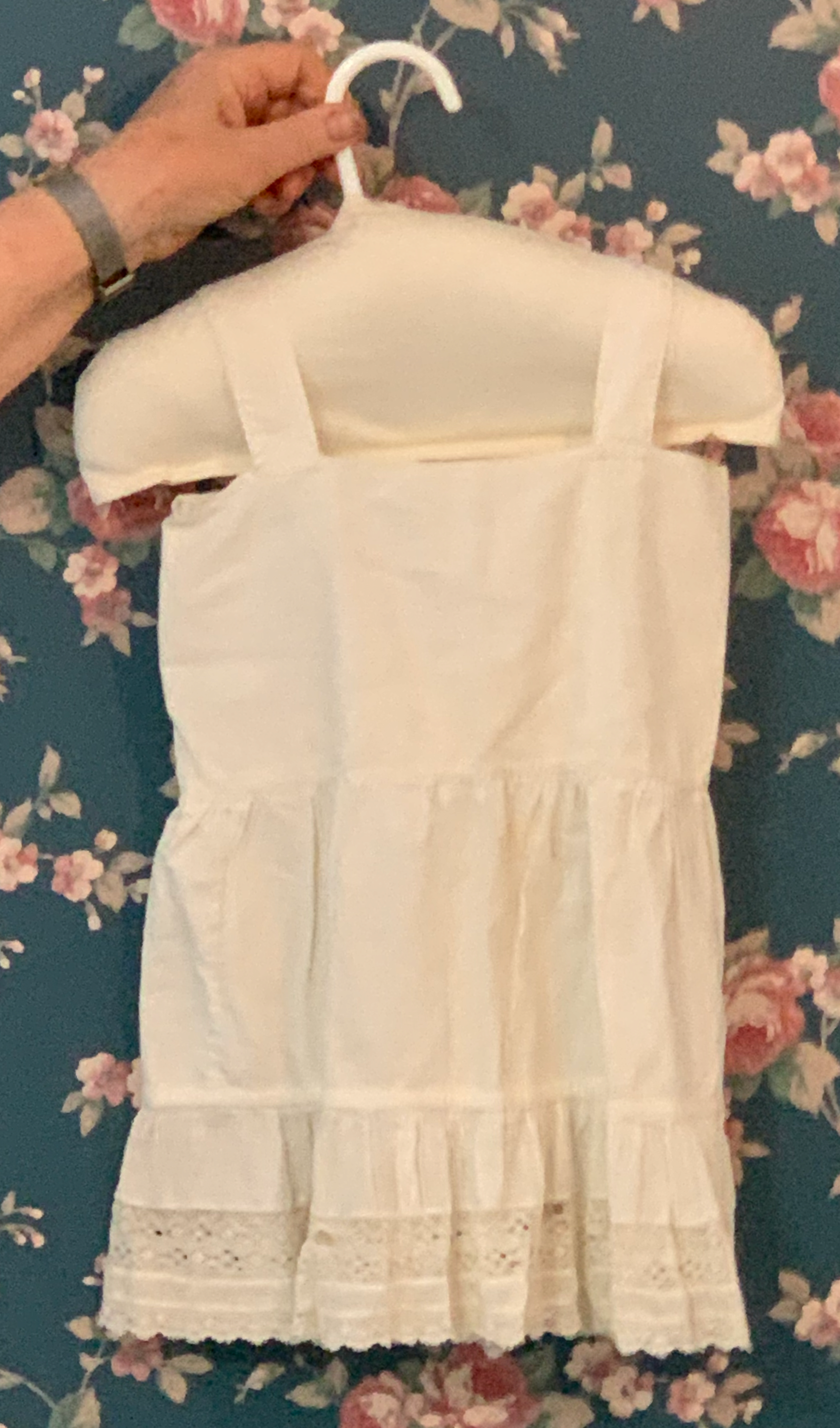 Child's white underdress with tiers of ruffles and trim