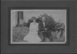 Rich, Frank & Ethel, happy couple dressed formally, sitting outside