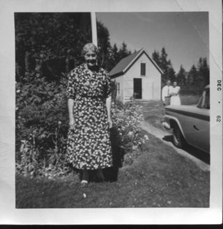 Emily Maria Rich in front of her garage on Lopaus Pt.