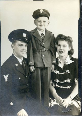 Formal photo of Harvey M. Sawyer family with son Harvey.