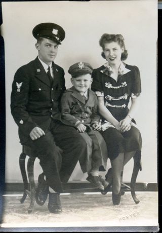 Formal photo of Harvey M. Sawyer family with son Harvey.