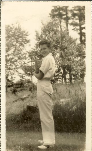 young Paul Hinton with cat