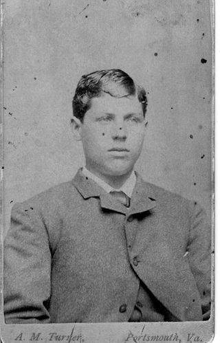 Loren W. Rumill, young man, dressed in suit