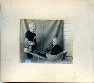 Hand bound album of 7 photos of Ruth and Harvey Moore, toddlers