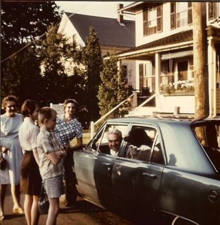 Albert Gott parked in car with family around