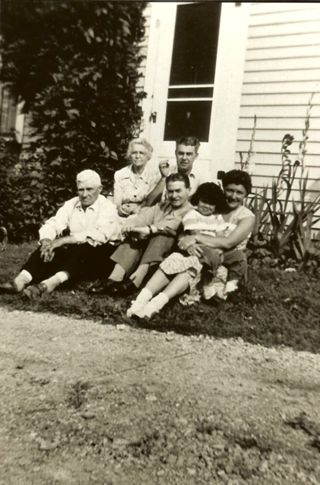 Sylvester, Esther, & Albert Gott, Frank O'Kane & young Betsy Nelson in the lap of Evelyn Gott's friend.