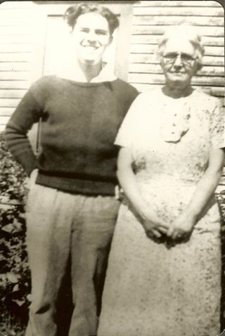 Albert & Esther Gott standing outside