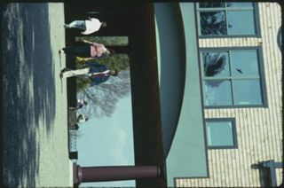 Unknown people walking across Red Bricks