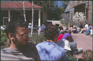Unknown people sitting on Red Bricks